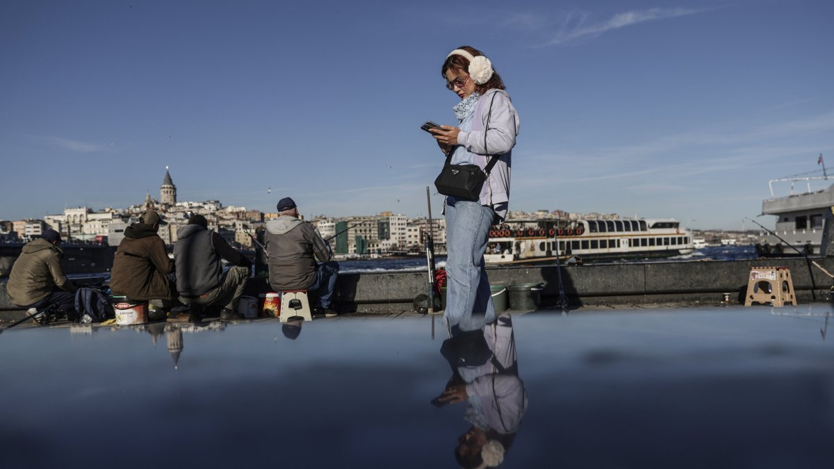People enjoy the view near the shore, Istanbul, Türkiye, Nov. 25, 2025.
