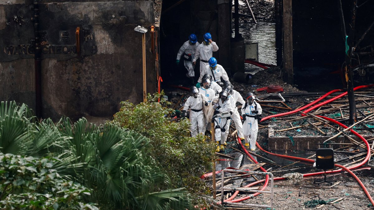 Hong Kong arrests 13 over unsafe materials as fire toll hits 151