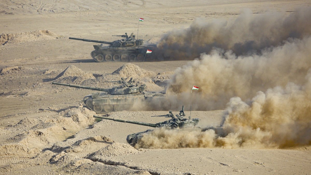 Tajikistan&#039;s tanks roll during a joint military drills by Russia and Uzbekistan at Harb-Maidon firing range about 20 kilometers (about 12 miles) north of the Tajik border with Afghanistan, in Tajikistan, Aug. 10, 2021. (AP Photo)