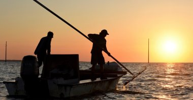 The work day begins early for oyster harvesters in the Florida panhandle&#039;s Apalachicola Bay, U.S., May 25, 2016. (AP Photo)