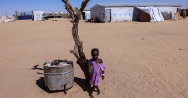 Fatma Issa, 5, a Sudanese refugee girl from el-Fasher, poses at the Tine transit refugee camp in eastern Chad, Nov. 22, 2025. (Reuters Photo)