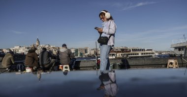 People enjoy the view near the shore, Istanbul, Türkiye, Nov. 25, 2025.