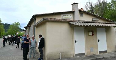 People stand outside a mosque in La Grand-Combe, southern France, April 27, 2025. (AFP Photo)
