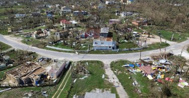 An aerial view shows damaged buildings in the aftermath of Hurricane Melissa in Lewis Town, St Elizabeth, Jamaica, Oct. 31, 2025. (AFP Photo)