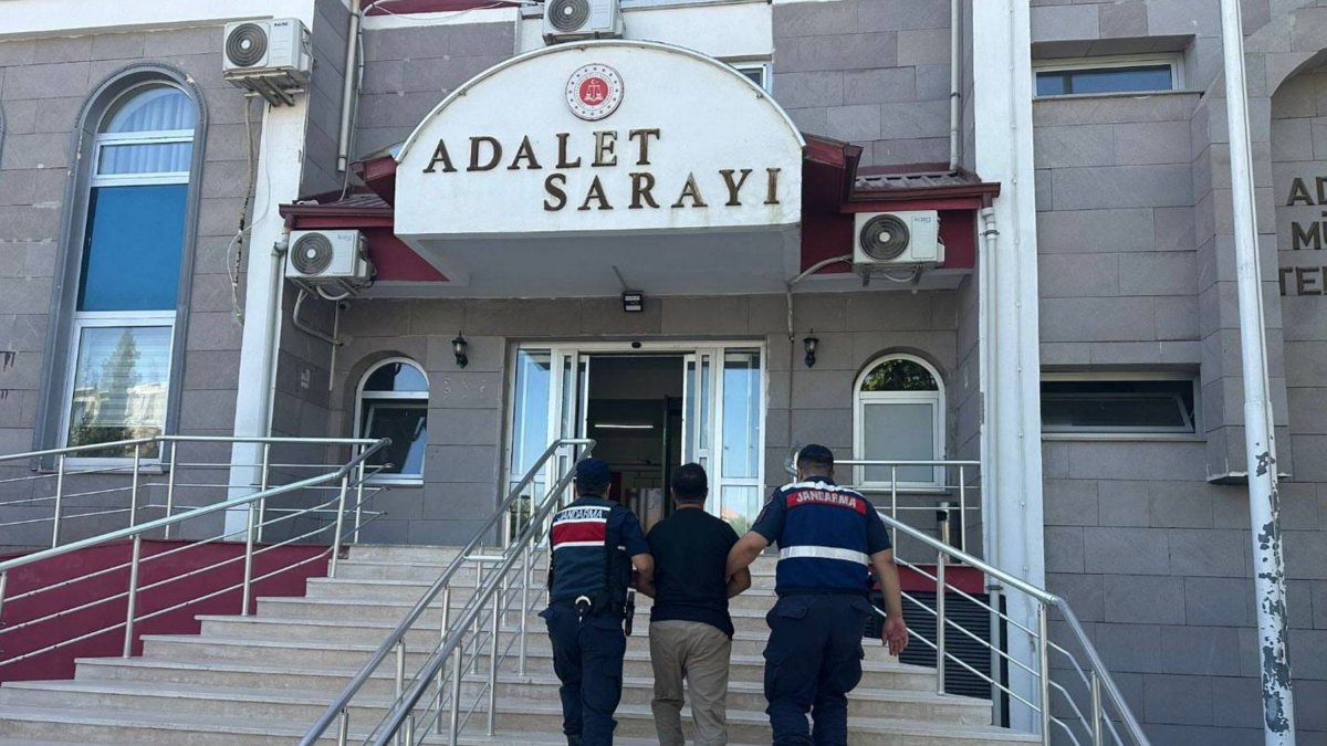 Officers escort a fugitive FETÖ suspect captured in an operation, Adıyaman, southern Türkiye, Aug. 5, 2025. (AA Photo)