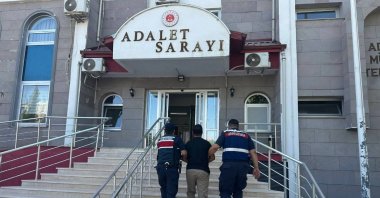Officers escort a fugitive FETÖ suspect captured in an operation, Adıyaman, southern Türkiye, Aug. 5, 2025. (AA Photo)