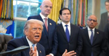 President Donald Trump answers questions from reporters during a meeting with the White House task force on the 2026 FIFA World Cup in the Oval Office of the White House, Washington, U.S., Nov. 17, 2025. (AP Photo)