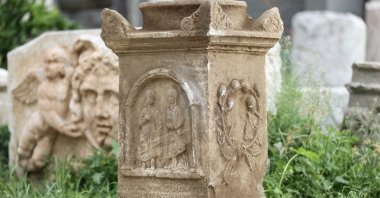 An altar-shaped Roman-era grave stele with human figures, found in Muğla, southwestern Türkiye, Nov. 29, 2025. (AA Photo)