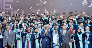 Maarif graduates celebrate with TMV President Mahmut Özdil during a graduation ceremony, Istanbul, Türkiye, July 3, 2025. (Courtesy of TMV)