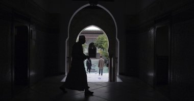 A man walks inside a mosque in Paris, France, Oct. 29, 2020. (AP Photo)