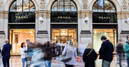 People walk past a Prada store in Galleria Vittorio Emanuele II, in Milan, Italy, Sept. 27, 2025. (Reuters Photo)
