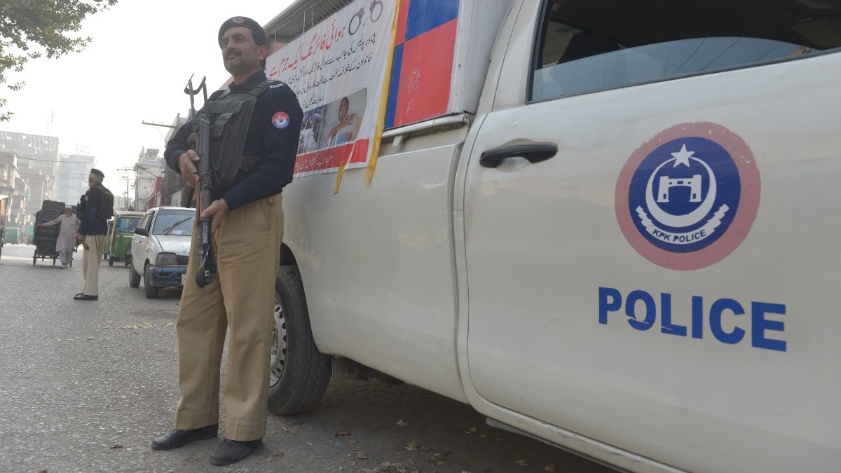 Pakistani Police officers stand guard at a checkpoint in Peshawar, Pakistan, Nov. 25, 2025.  (EPA Photo)