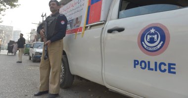 Pakistani Police officers stand guard at a checkpoint in Peshawar, Pakistan, Nov. 25, 2025.  (EPA Photo)