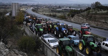 Farmers gather with their tractors during a protest to block the road leading to the customs of Promachonas, in the border of Greece and Bulgaria at the Malgara tolls near Thessaloniki, Dec. 3, 2025. (AFP Photo)