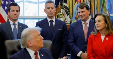 Jim Farley, Ford CEO (2nd-R) reacts as U.S. President Donald Trump announces new fuel economy standards, in the Oval Office at the White House in Washington, D.C., U.S., Dec. 3, 2025. (Reuters Photo)