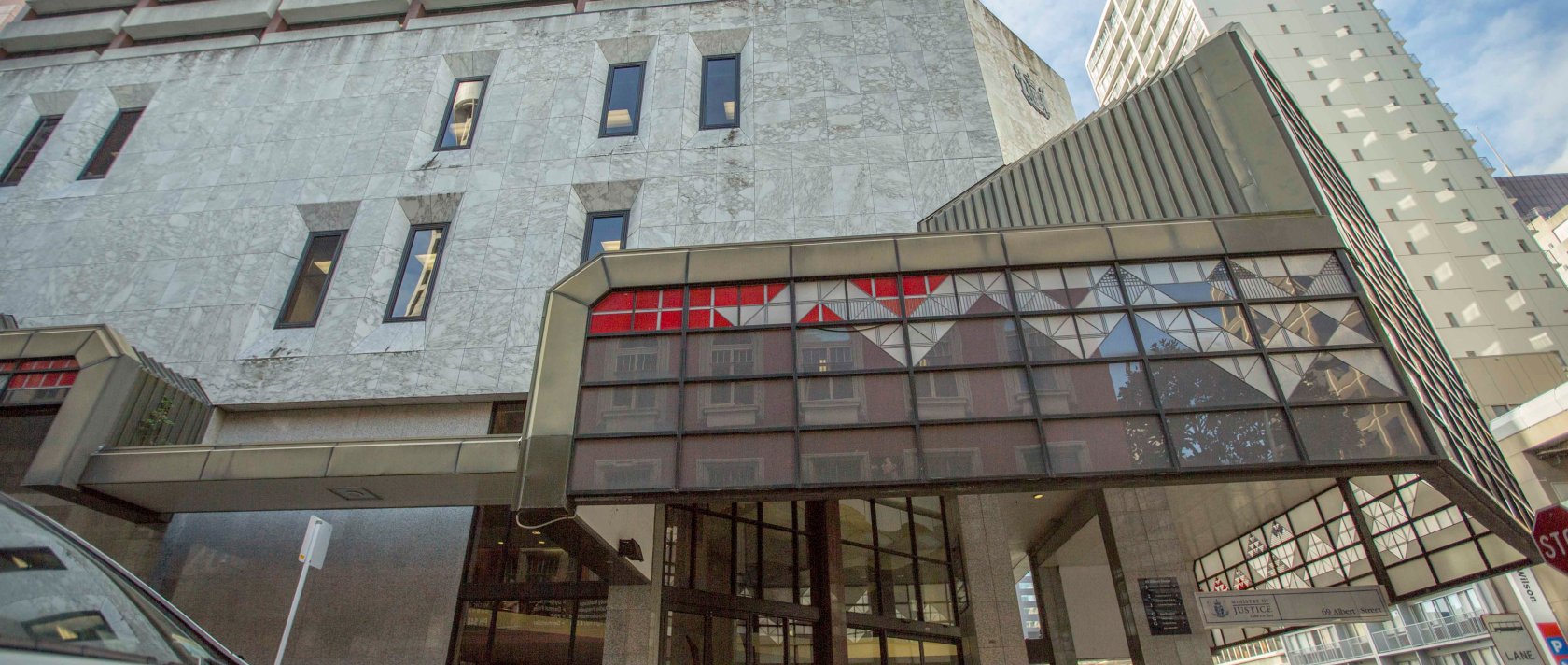 A police car is parked outside the Auckland District Court, Auckland, New Zealand, Aug. 17, 2015. (AP Photo)