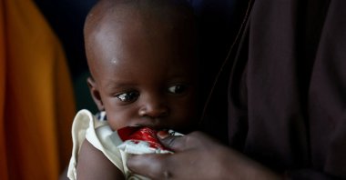 A malnourished child is fed with Ready-to-use Supplementary Food (RUSF) by her mother, in Dikwa, Borno State, Nigeria, Aug. 27, 2025. (Reuters Photo)