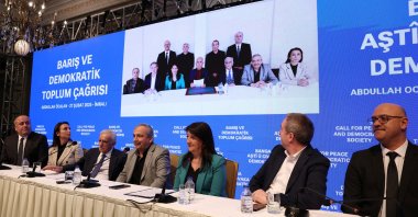 Politicians from the Peoples&#039; Equality and Democracy Party (DEM Party) relay the message of terrorist group PKK leader Abdullah Öcalan (in the background) at a news conference, Istanbul, Türkiye, Feb. 27, 2025. (Reuters Photo)
