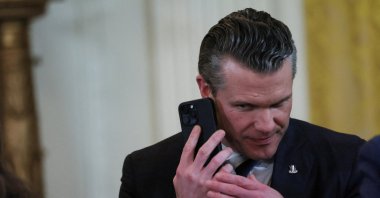 U.S. Defense Secretary Pete Hegseth uses a phone as he attends a joint press conference of U.S. President Donald Trump and Israeli Prime Minister Benjamin Netanyahu in the East Room at the White House, Washington, U.S., Feb. 4, 2025. (Reuters Photo)