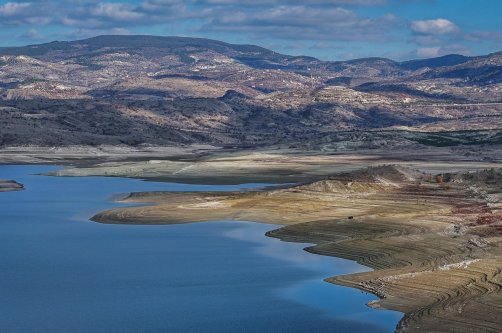 An aerial view of the partially emptied Çamlıdere Dam shows the visibly reduced water levels in Ankara, Türkiye, Dec. 3, 2025. (AA Photo)
