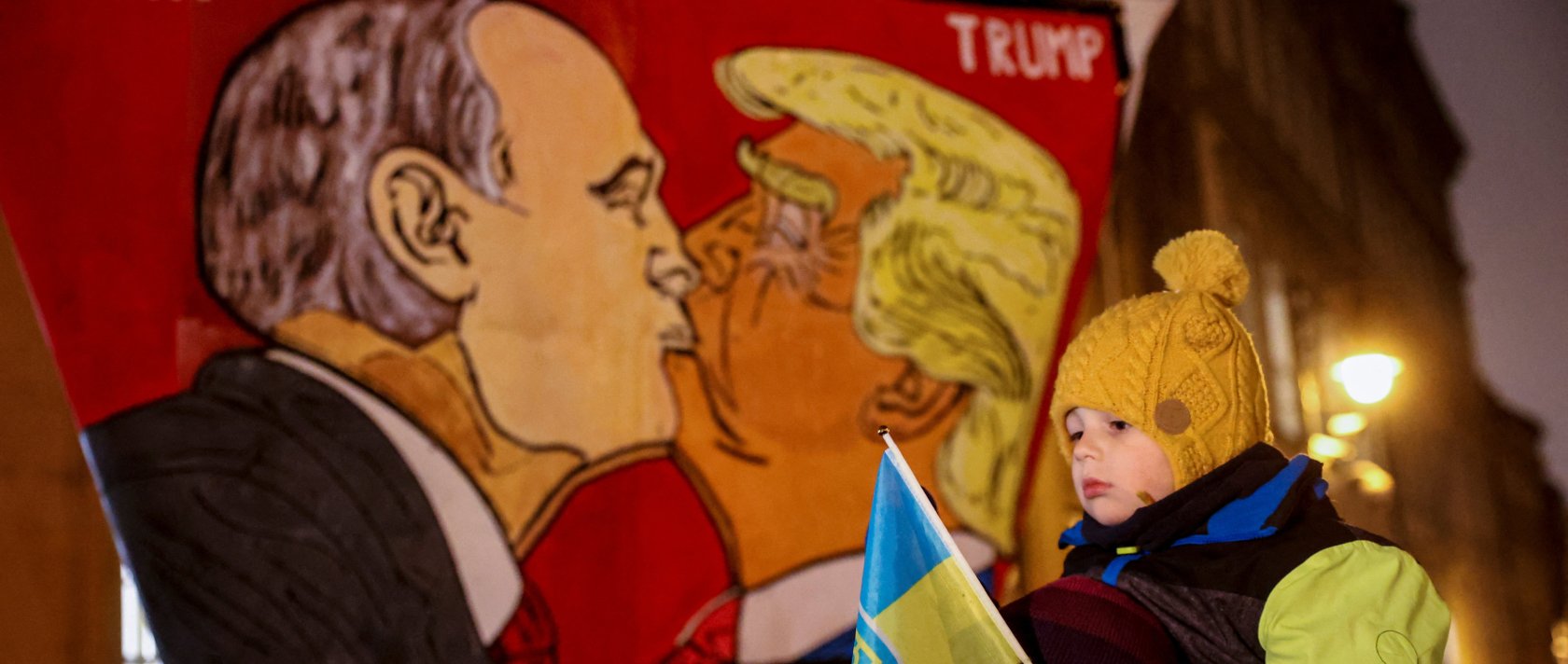 Protesters display a banner with caricatures of Russian President Vladimir Putin and U.S. President Donald Trump as people demonstrate against Trump&#039;s 29-point peace plan, in front of the U.S. Embassy, Prague, Czechia, Nov. 25, 2025. (Reuters Photo)