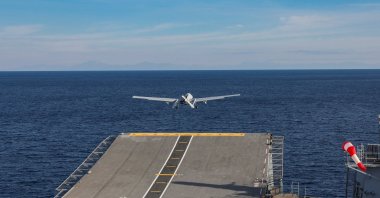 The Bayraktar TB3 drone takes off from the TCG Anadolu warship during a trial in the Mediterranean, Dec. 4, 2025. (IHA Photo)