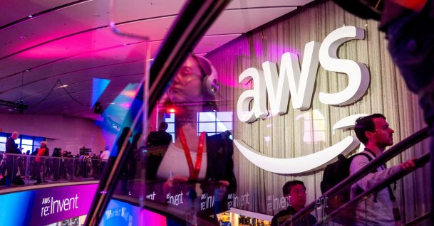 Attendees pass a logo at AWS re:Invent 2024, Las Vegas, Nevada, U.S., Dec. 2, 2024. (Reuters Photo)