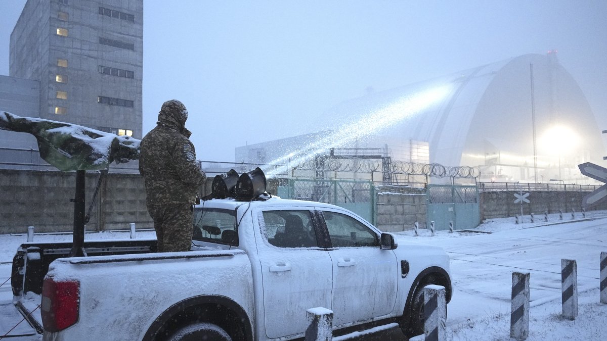 Ukrainian serviceman stands on a vehicle with anti-aircraft gun after a drone attack at the former Chernobyl nuclear power plant, Ukraine, Feb. 14, 2025. (AP Photo)