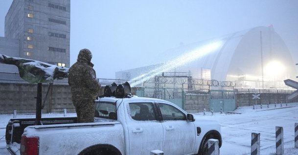 Ukrainian serviceman stands on a vehicle with anti-aircraft gun after a drone attack at the former Chernobyl nuclear power plant, Ukraine, Feb. 14, 2025. (AP Photo)