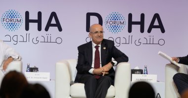 Treasury and Finance Minister Mehmet Şimşek speaks at a panel of the Doha Forum, Doha, Qatar, Dec. 6, 2025. (AA Photo)