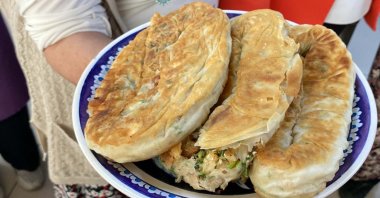 A traditional village pastry is prepared during a documentation session, Izmir, Türkiye, Dec. 7, 2025. (DHA Photo)