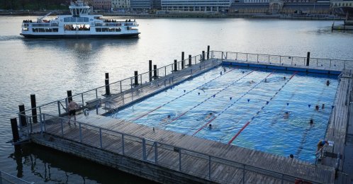 People enjoy in a public pool in Helsinki, Finland, Nov. 14, 2025. (AP Photo)