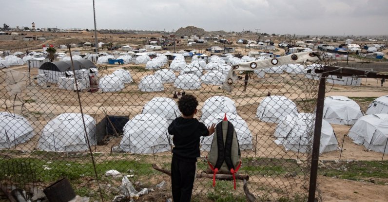 A child looks on as people prepare their tents inside a camp in Khan Younis, southern Gaza Strip, Palestine, Dec. 6, 2025. (EPA Photo)