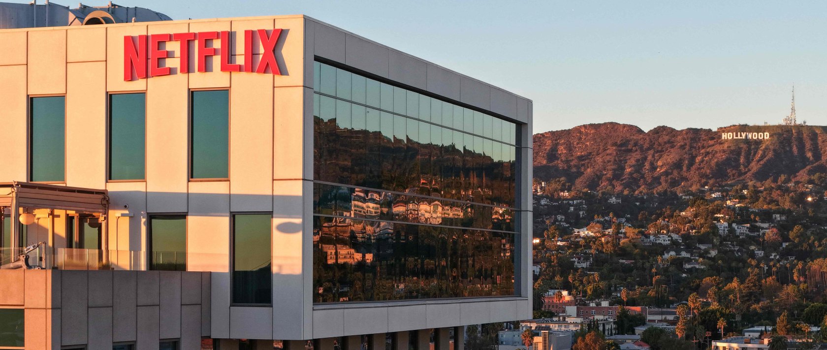 An aerial view of the Netflix logo displayed at Netflix studios, with the Hollywood sign in the distance, in Los Angeles, California, U.S., Dec. 5, 2025. (AFP Photo)