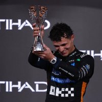 McLaren&#039;s Lando Norris celebrates on the podium with the trophy after becoming the 2025 Formula 1 World Champion, Abu Dhabi Grand Prix, Abu Dhabi, United Arab Emirates, Dec. 7, 2025. (Reuters Photo)