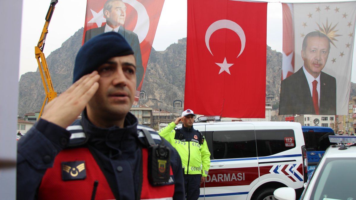 Gendarmerie and police forces stand ready in a ceremony as flags wave behind, Amasya, Türkiye, Dec. 6, 2025. (İHA Photo)