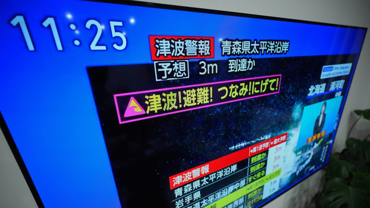 A tsunami warning is displayed on a television in Yokohama, near Tokyo, Monday, Dec. 8, 2025, after a strong earthquake hits off Japanese northern coast, tsunami alert issued. (AP Photo)