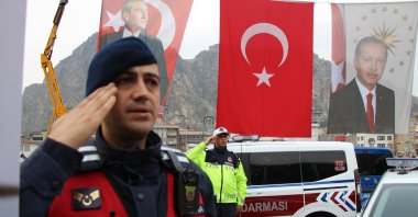 Gendarmerie and police forces stand ready in a ceremony as flags wave behind, Amasya, Türkiye, Dec. 6, 2025. (İHA Photo)
