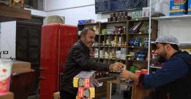 Abdullah Dibo, who fled to Türkiye because of the war and lived in Gaziantep for about 13 years, works at his shop in the Bab district of Aleppo, Syria, Dec. 7, 2025. (AA Photo)