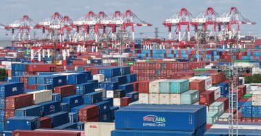 An aerial view shows stacked containers at the Shanghai Port container terminal in Shanghai, China, Dec. 8, 2025. (AFP Photo)