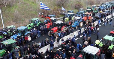 Farmers and livestock breeders from Kozani, Grevena, and Kastoria have lined up their tractors, setting up a joint agricultural blockade at the Siatista intersection, on the Egnatia motorway, in Kozani, northern Greece, Dec. 6, 2025. (EPA Photo)