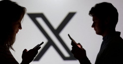 Teenagers pose for a photo while holding smartphones in front of an X logo in this illustration, Sept. 11, 2025. (Reuters Photo)