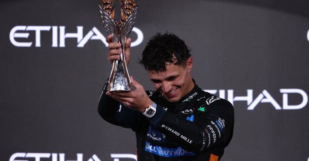McLaren&#039;s Lando Norris celebrates on the podium with the trophy after becoming the 2025 Formula 1 World Champion, Abu Dhabi Grand Prix, Abu Dhabi, United Arab Emirates, Dec. 7, 2025. (Reuters Photo)