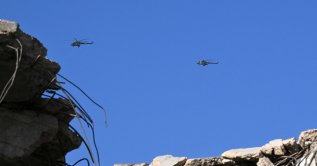 Syrian army helicopters hover over Darayya near Mezzeh Airport in Damascus, Nov. 10, 2025. (AFP Photo)