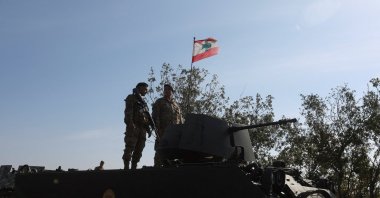 Lebanese army members stand on a military vehicle during a Lebanese army media tour, Alma Al-Shaab, near the border with Israel, Lebanon, Nov. 28, 2025. (Reuters Photo)