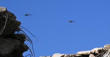 Syrian army helicopters hover over Darayya near Mezzeh Airport in Damascus, Nov. 10, 2025. (AFP Photo)