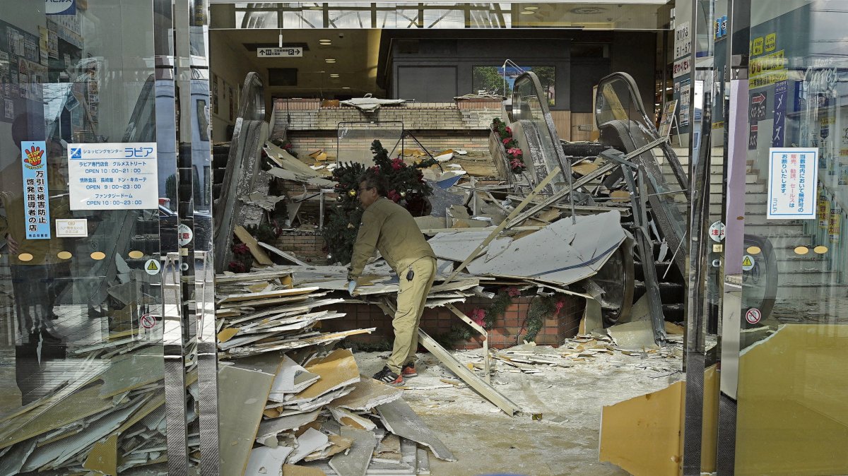 A worker cleans up inside a commercial facility in Hachinohe following a strong earthquake the previous night, Aomori Prefecture, Japan, Dec. 9, 2025. (Reuters Photo)