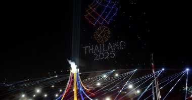 The Grand Cauldron is lit while synchronised drones form the 33rd SEA Games Thailand 2025 emblem in the sky during the opening ceremony at the Rajamangala National Stadium, Bangkok, Thailand, Dec. 9, 2025. (Reuters Photo)