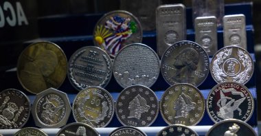 Silver coins are displayed in Manhattan, New York, U.S., Dec. 9, 2025. (AFP Photo)