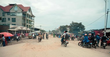 Passengers are driven on motorbike taxis along a road in Uvira, DR Congo, Dec. 9, 2025. (AFP Photo)